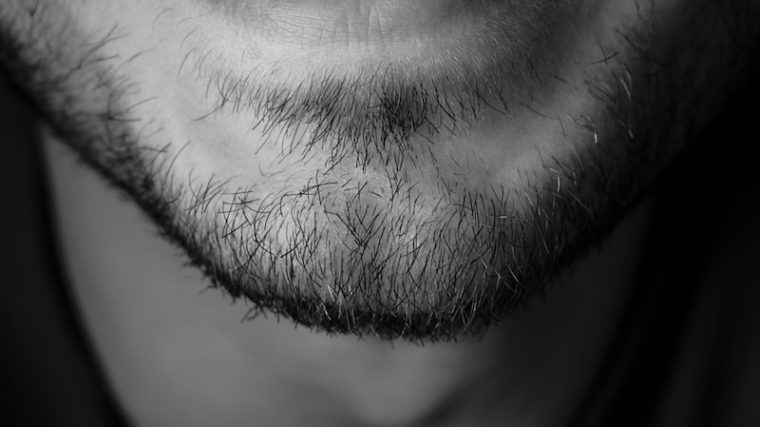 grayscale photo of mans face