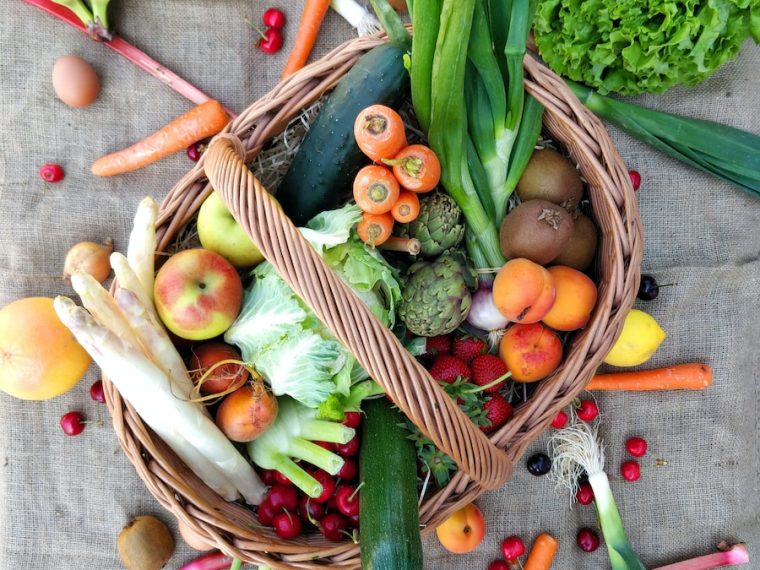 a basket filled with lots of different types of vegetables